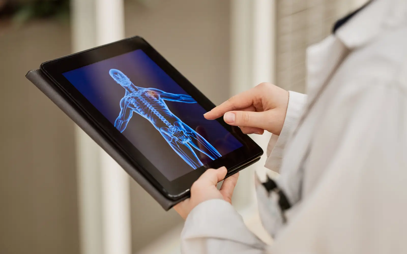 Clinician reviewing a three dimensional body composition scan on a tablet